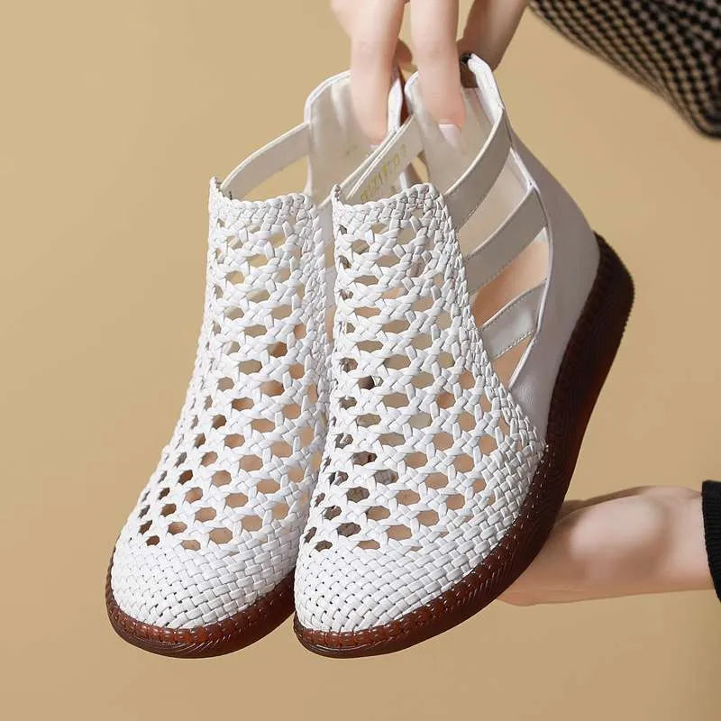 Women's flat gold sandals with hollow-out design and soft sole.