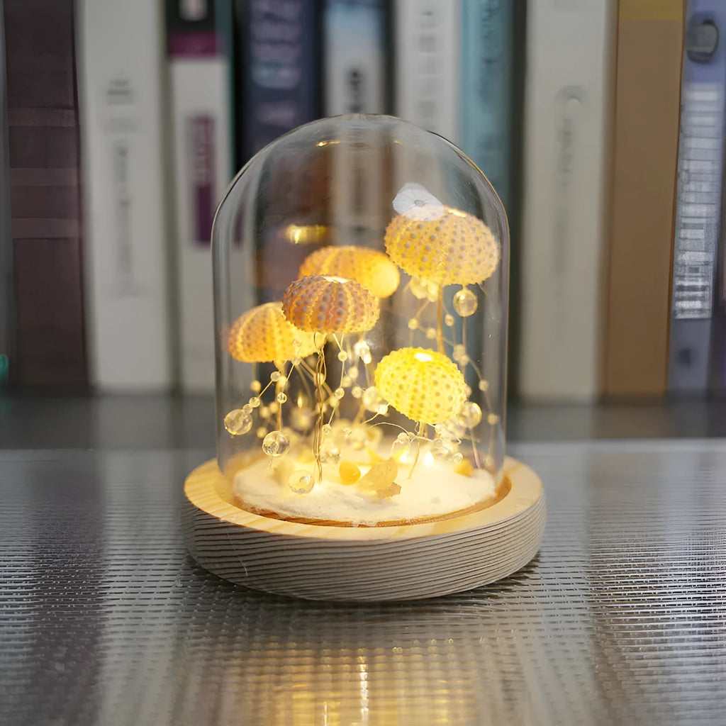 Handmade sea urchin shell jellyfish lamp inside a cylindrical clear glass cover, creative night light with built-in battery