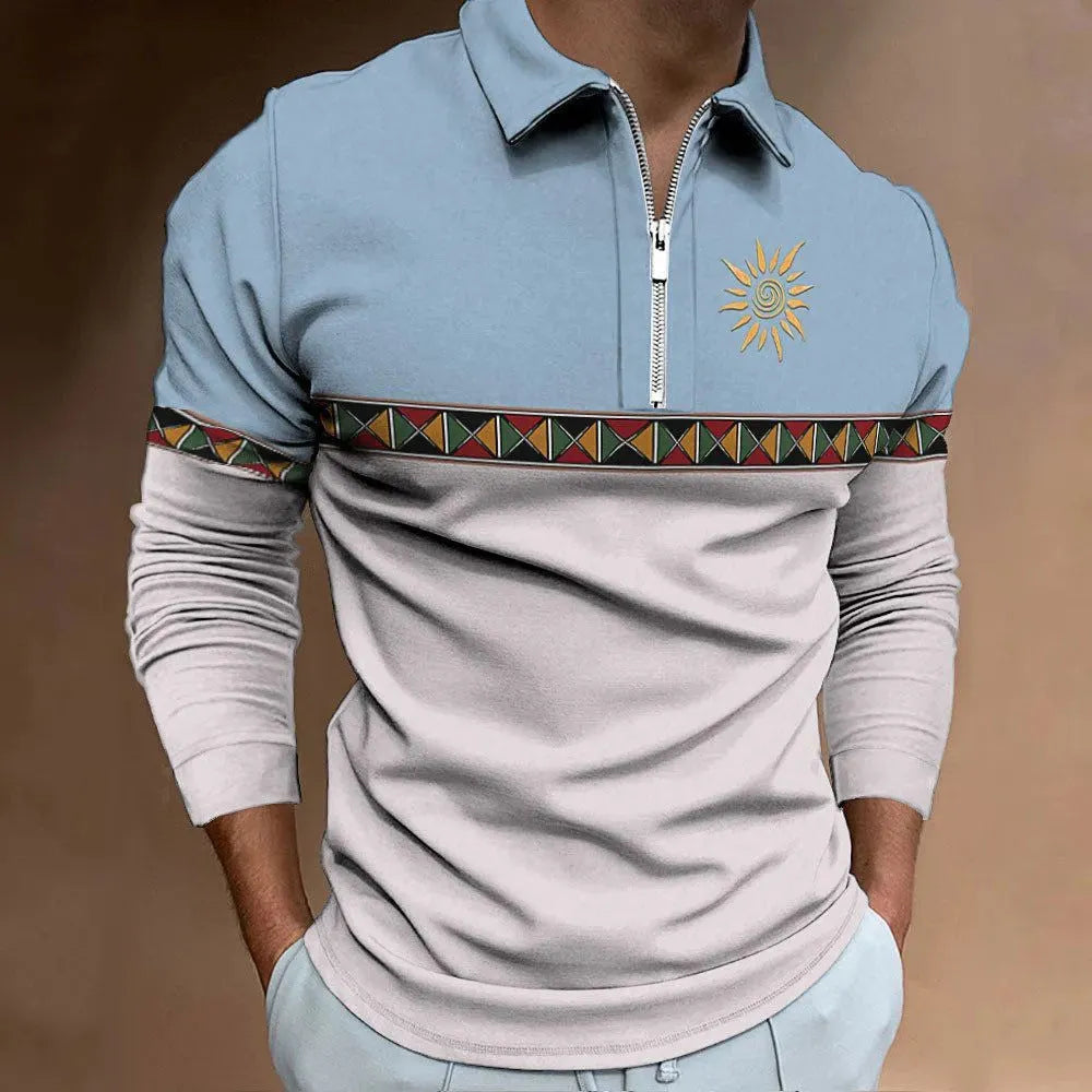 Man wearing a loose-fit long sleeve t-shirt with retro colour printing and zipper details.