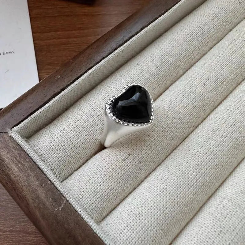S925 sterling silver ring with black heart agate stone on an adjustable band.