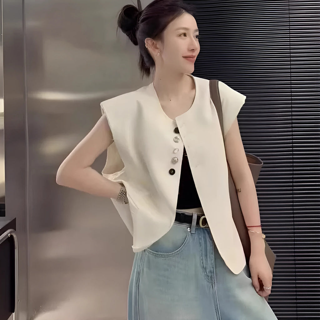 Women's beige loose-fit polyester vest with a pocket, shown on a hanger.