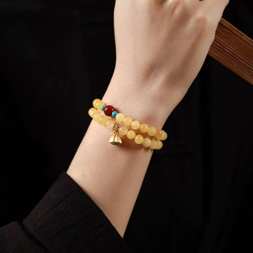 Yellow jade handmade double ring bracelet showing hand-woven texture and retro style