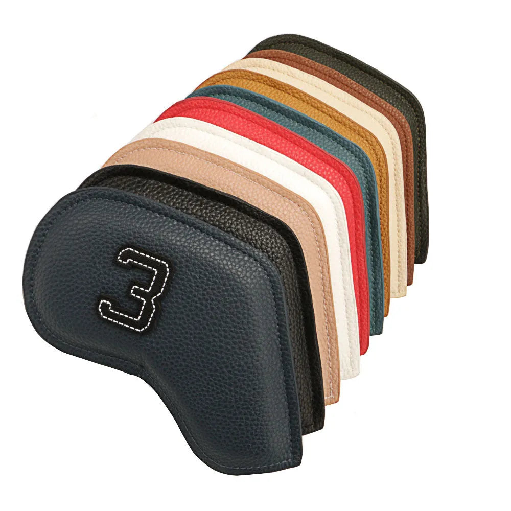 Set of 10 assorted coloured PU leather golf club head covers on a green background.