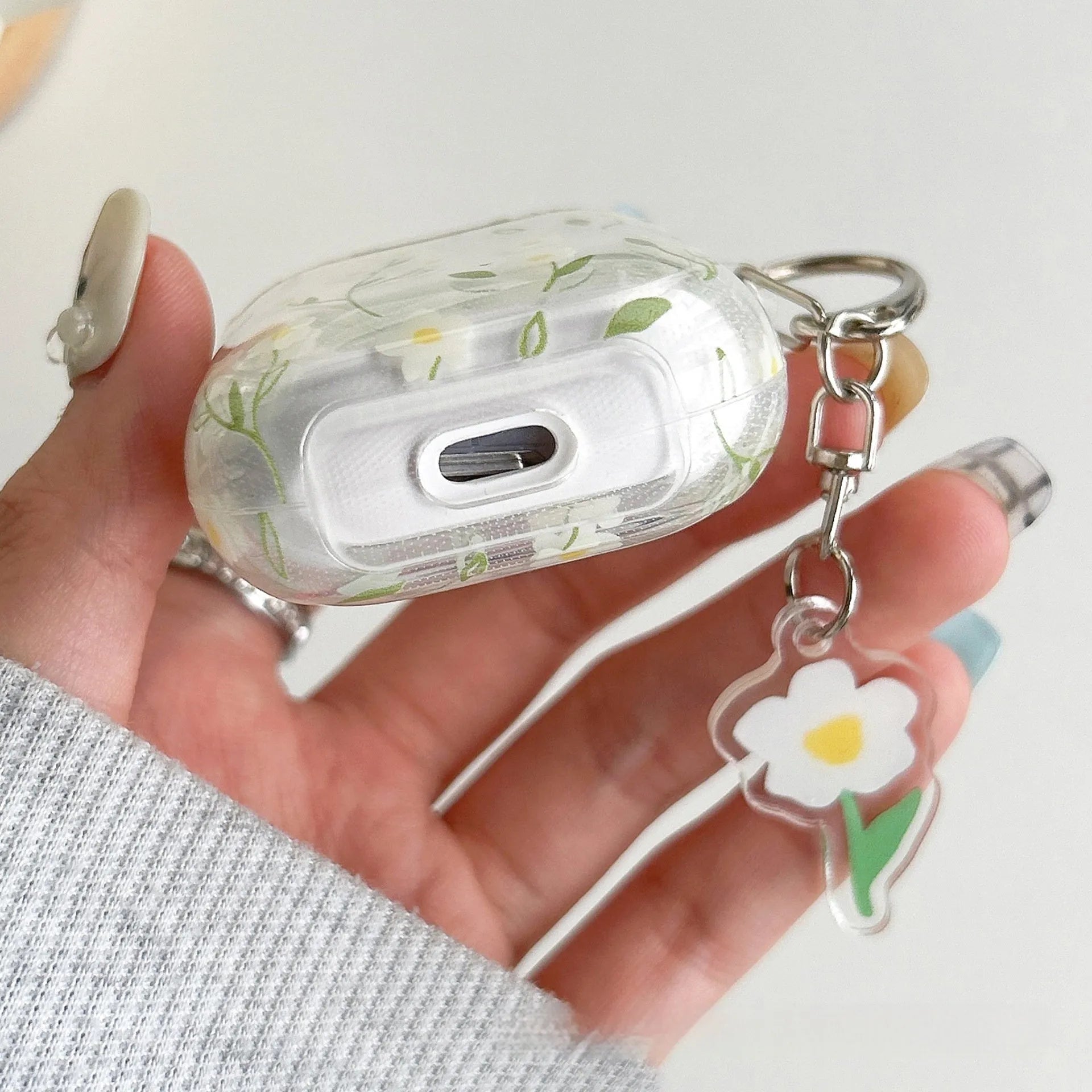 White transparent floral TPU protective cover for Apple AirPods showing decorative elements