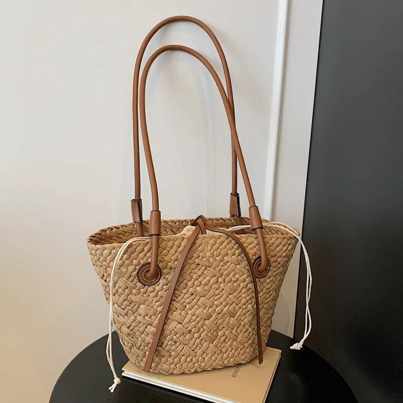 European retro style woven bag in khaki colour showing woven texture and horizontal square shape