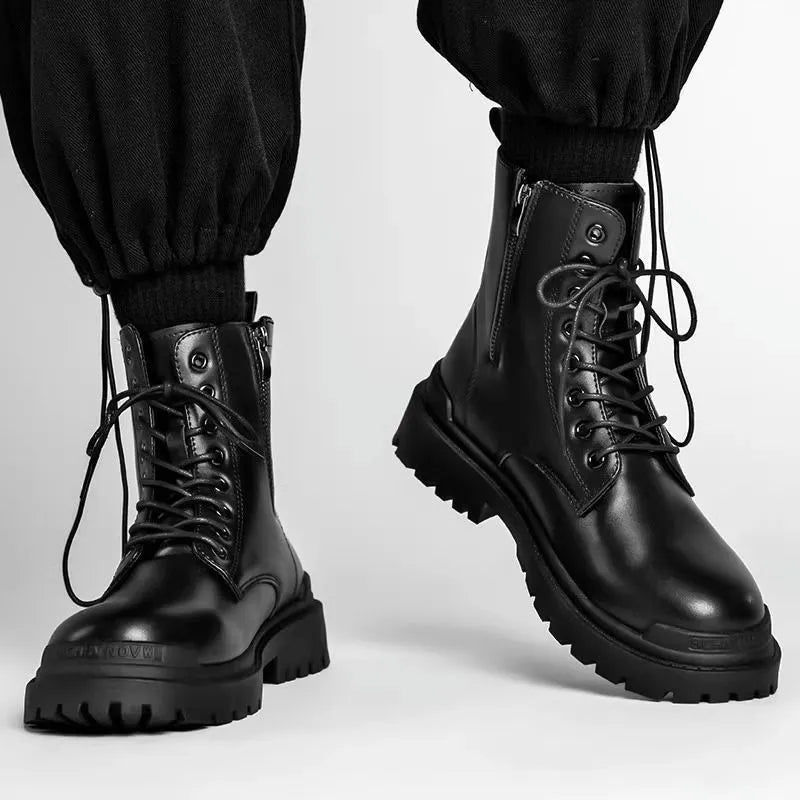 Men's black leather-look mid-top boots with a flat rubber sole on a neutral background
