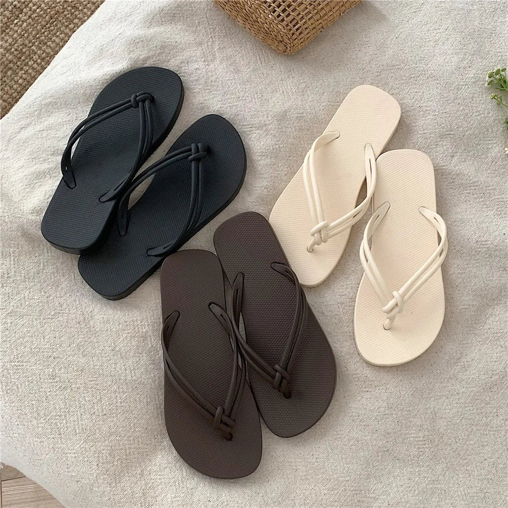 Men's casual PVC flip flops in beige with toe-covering design and textured non-slip sole.