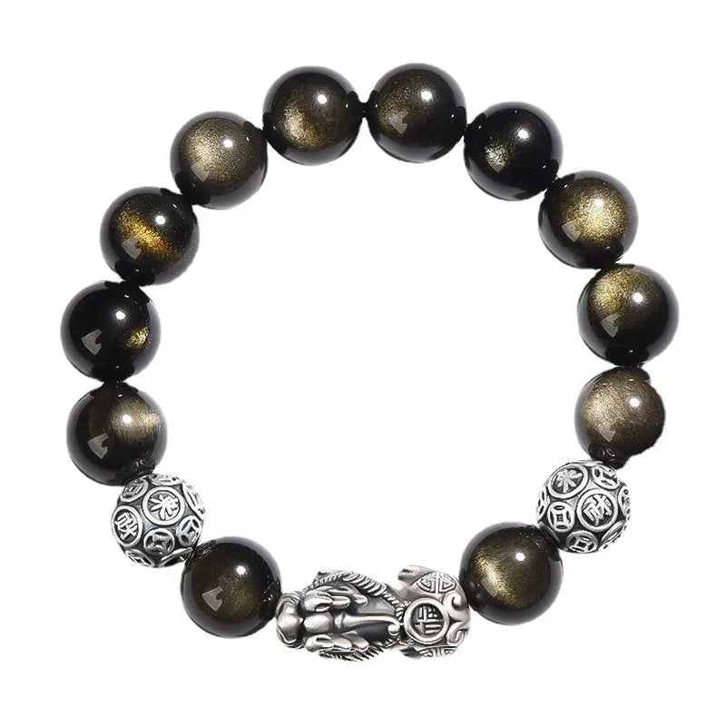 Men's geometric bracelet with a polished obsidian bead and 999 sterling silver on a leather strap.