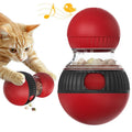 Rotating plastic cat toy with clear compartment showing super ball inside, food dispensing mechanism visible