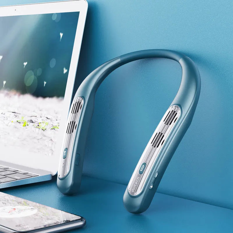 A person wearing a black wireless Bluetooth speaker around their neck for hands-free listening.