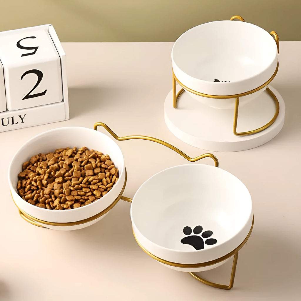 White ceramic pet bowl with cat footprints pattern in black iron frame with cat ears