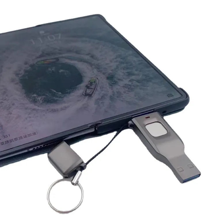 Black fingerprint encrypted USB drive with USB 3.0 and USB-C interfaces showing metal construction