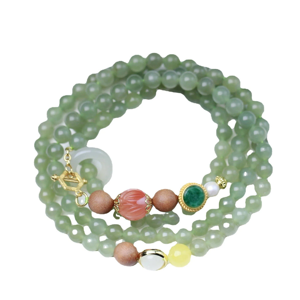 Hetian jade and sandalwood necklace with lotus beads and animal pendant, plus matching bracelet.