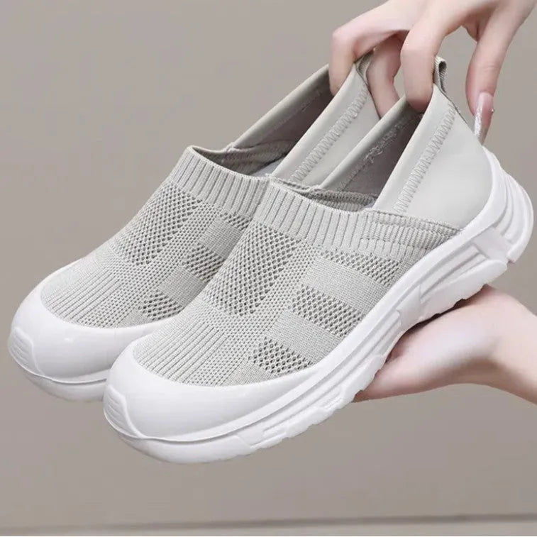 Women's black slip-on shoes with cloth upper and PVC sole in round-toe design