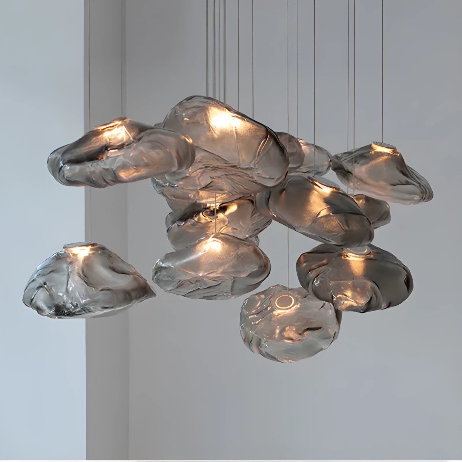 Modern fabric chandelier with glass shade in clear, amber, or smoke grey colour options.