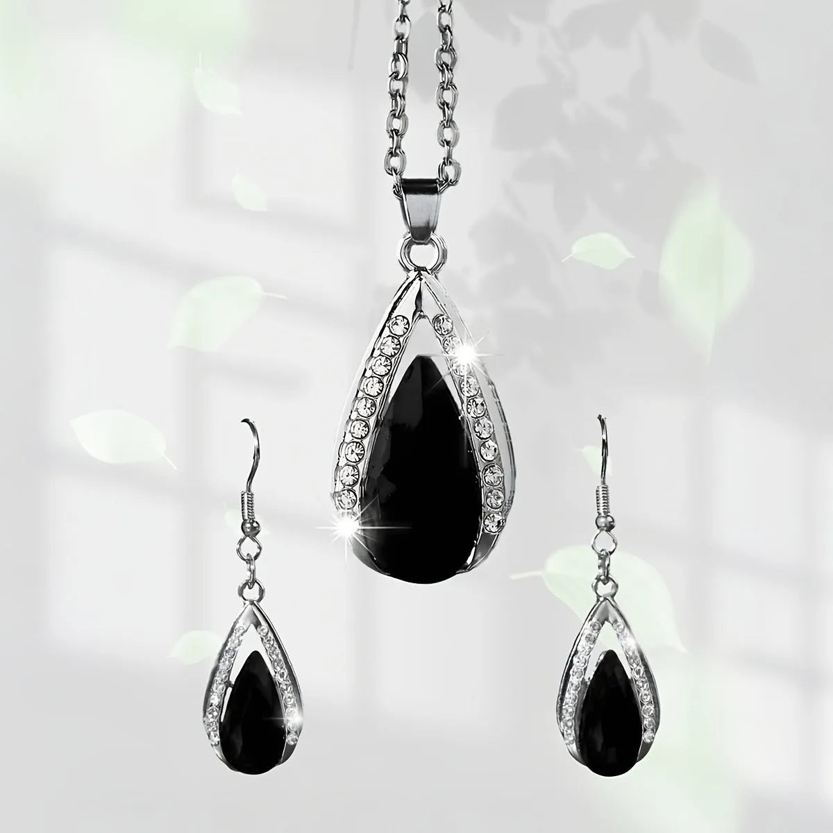 Black and red alloy teardrop pendant necklace with matching droplet earrings set.
