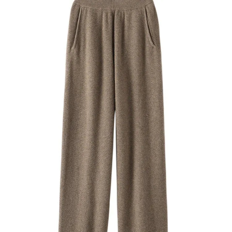 Women's thick cashmere leggings in green velvet colour, showing high elasticity and stitching detail.
