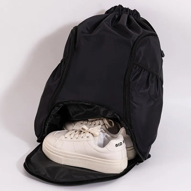 Large cube-style sports backpack in five colour options with drawstring closure and storage compartments