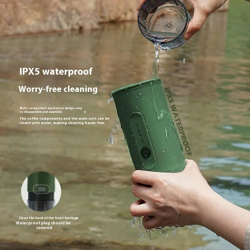 Handheld portable electric coffee machine in Jungle Green colour with car charger cable.