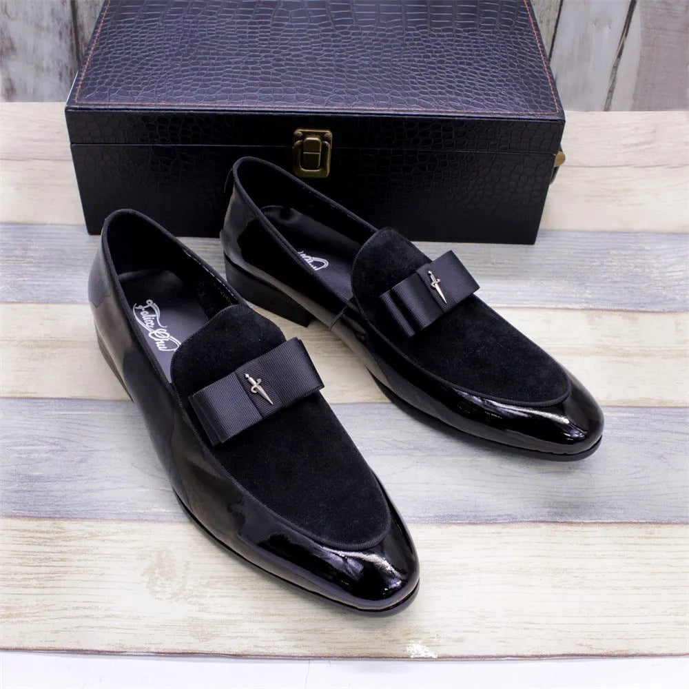 Men's low-top leather shoes in patent black with a tassel detail and rubber sole.