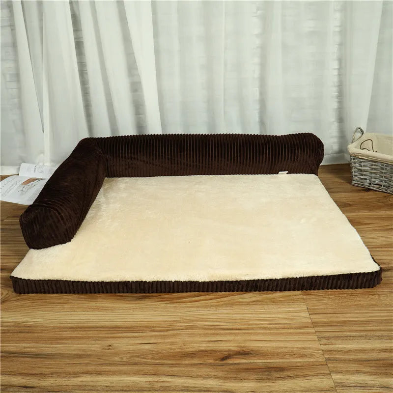 A large grey corduroy dog sofa bed with bilateral sides and a non-slip base on a wooden floor.