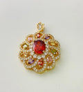 Close-up of a women's floral-shaped colourful zircon pendant necklace in a gold metal setting.