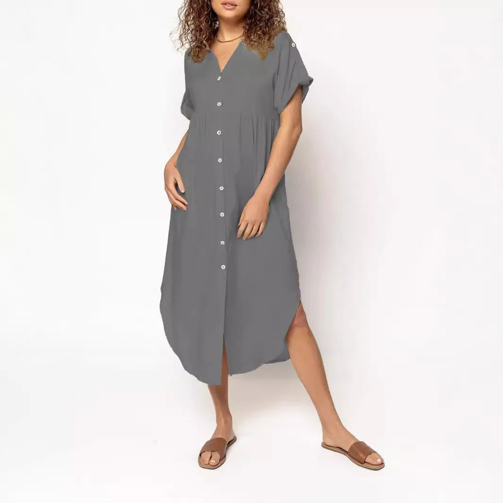 Loose mid-length casual dress in solid colour with button front detail, shown on a hanger.