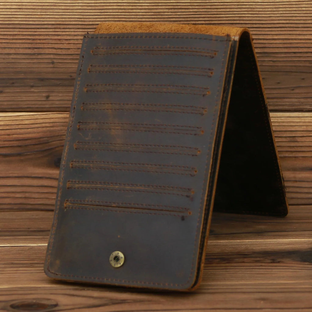 Men's long leather wallet open showing 18 card slots, cash compartment, and phone pocket.