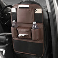 Leather car seat back storage bag in black, suspended behind a car headrest.
