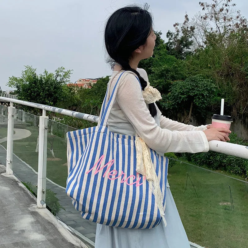 Blue striped letters printed cotton canvas bag in pink, blue and white stripes.