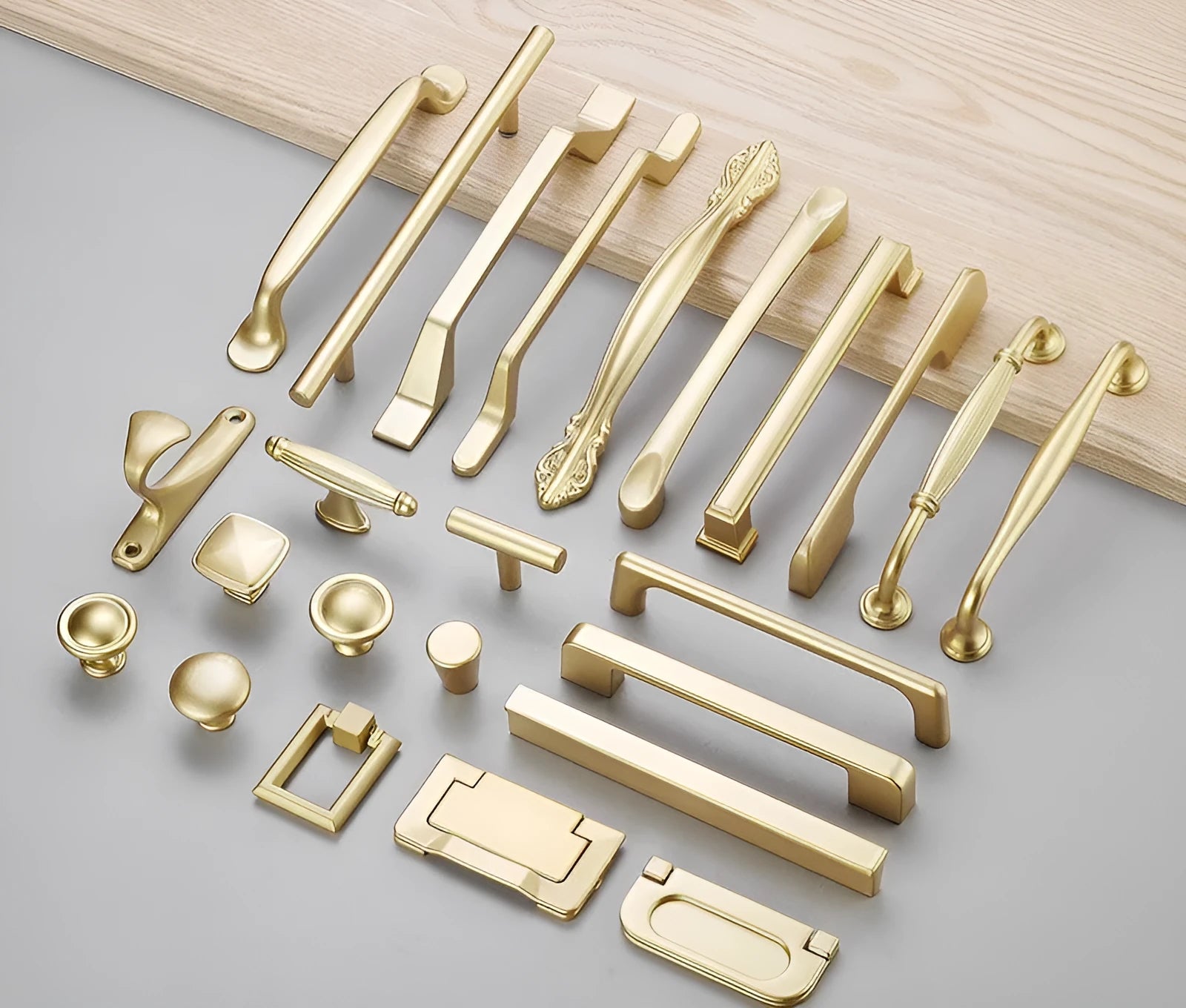 Gold aluminium alloy T‑shape single hole cabinet door handle.