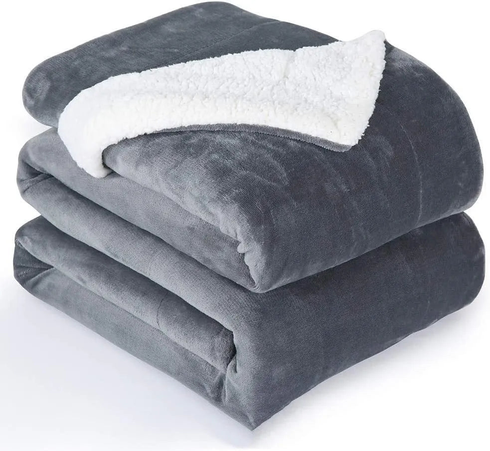Grey and white USB-powered flannel electric heating blanket laid flat.