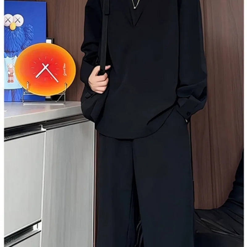 Men's black casual two-piece set with long sleeve polo shirt and matching trousers in slim fit design