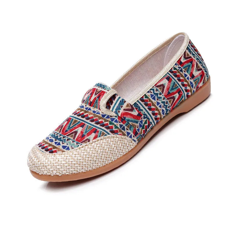 Women's ethnic style flat heel cloth shoes with colour stitching and shallow mouth design.