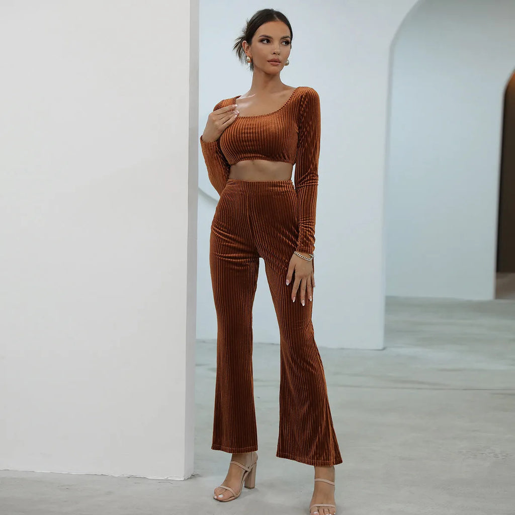 Caramel coloured long sleeve sweater and matching trousers casual set laid flat.