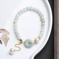Natural emerald jade pearl bracelet with geometric peace buckle pendant and Chinese national style design