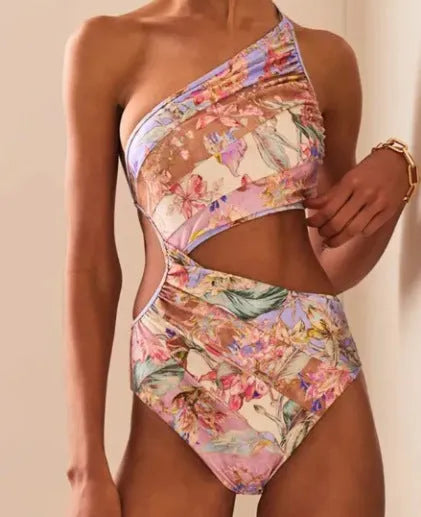 Rose gold patterned women's one-piece swimsuit on a mannequin.