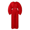 Red African suit two-piece set with batwing sleeve top and wide leg trousers on a mannequin.