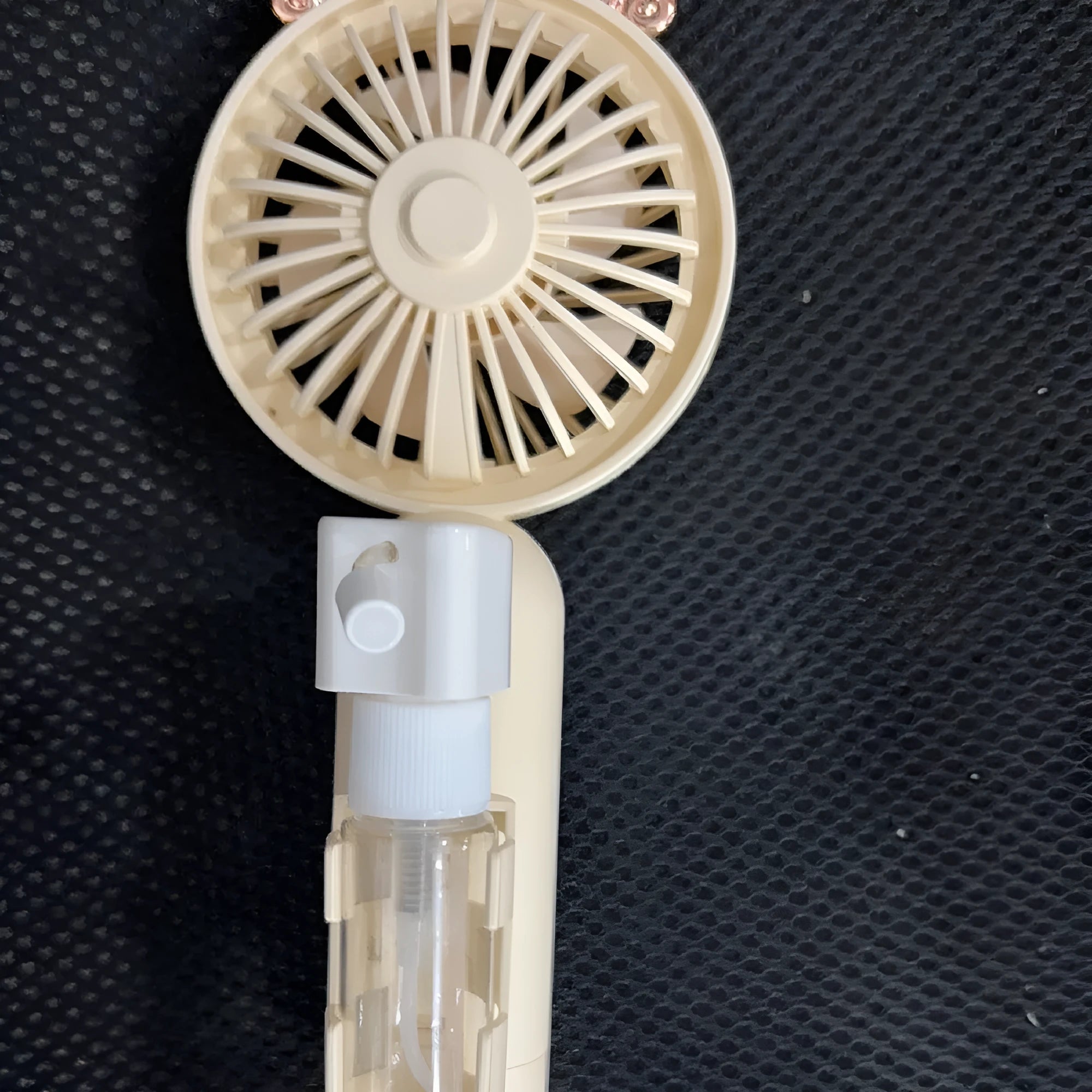 USB rechargeable personal plastic nozzle fan in apricot, blue, green, orange, or pink colours