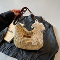 Women's woven straw messenger bag with hollowed design in khaki colour