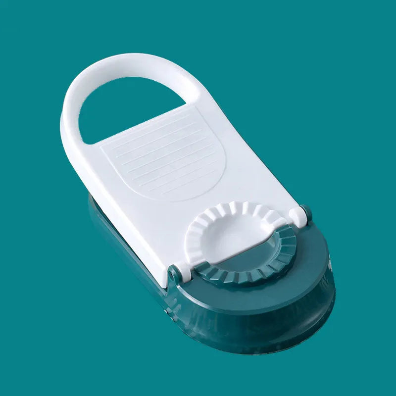 Orange and white plastic dumpling maker tool with ergonomic handle and hanging hole