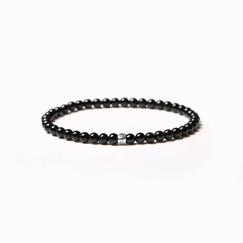 Electroplated agate obsidian blue San bracelet with 4mm geometric beads on wrist
