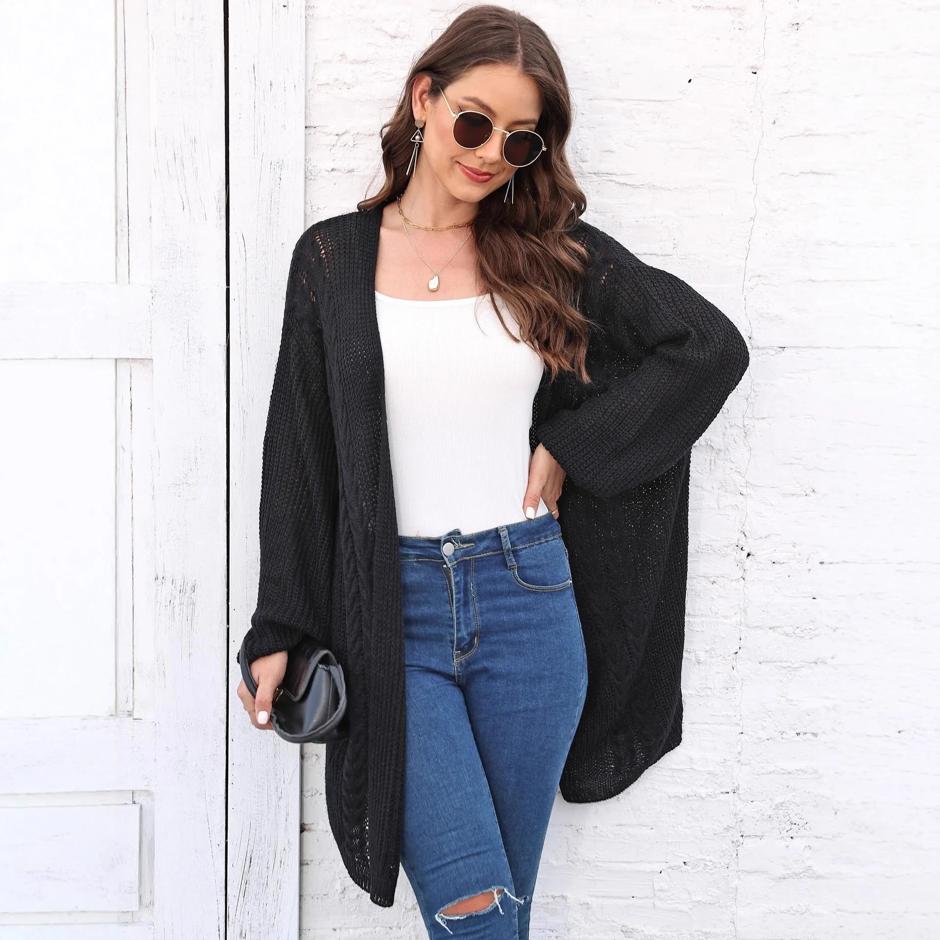 Women's loose-fit solid-colour acrylic sweater coat shown in light grey