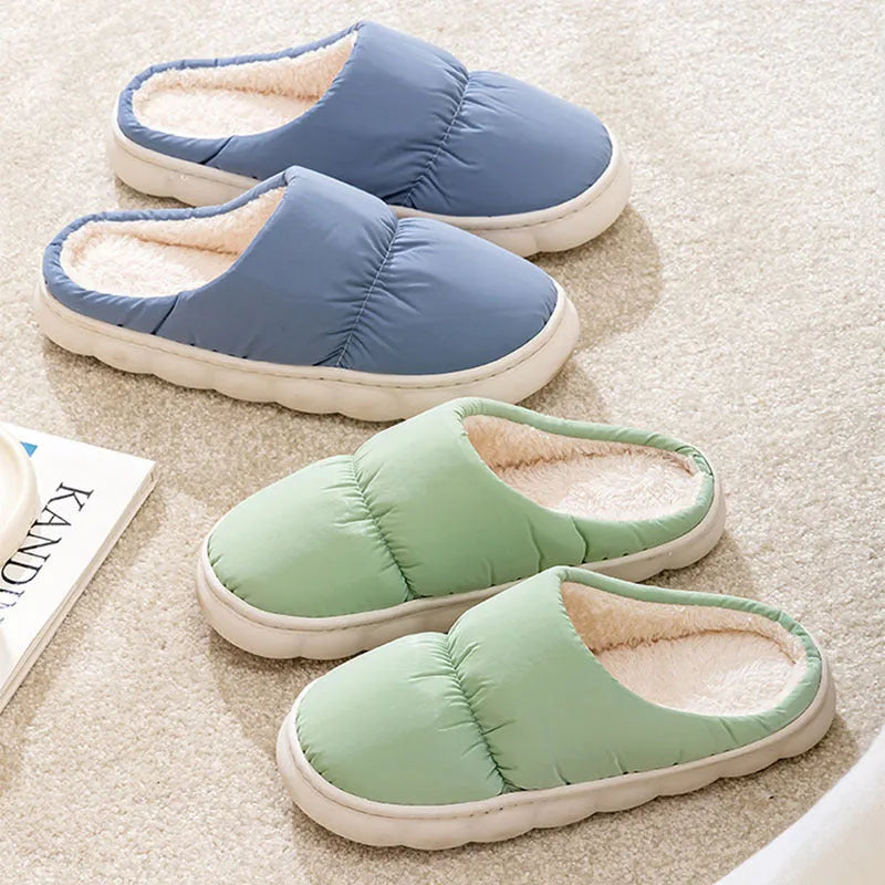 Blue down cotton slippers with artificial leather uppers, thick rubber soles, and plush lining for indoor winter wear.