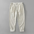 Man wearing loose straight-leg cotton linen trousers in a brown colour, showcasing the retro Japanese style.