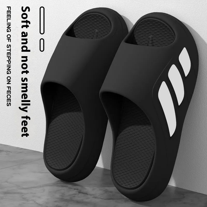 Brown and black two-tone EVA platform slippers with injection moulded soles on wooden floor