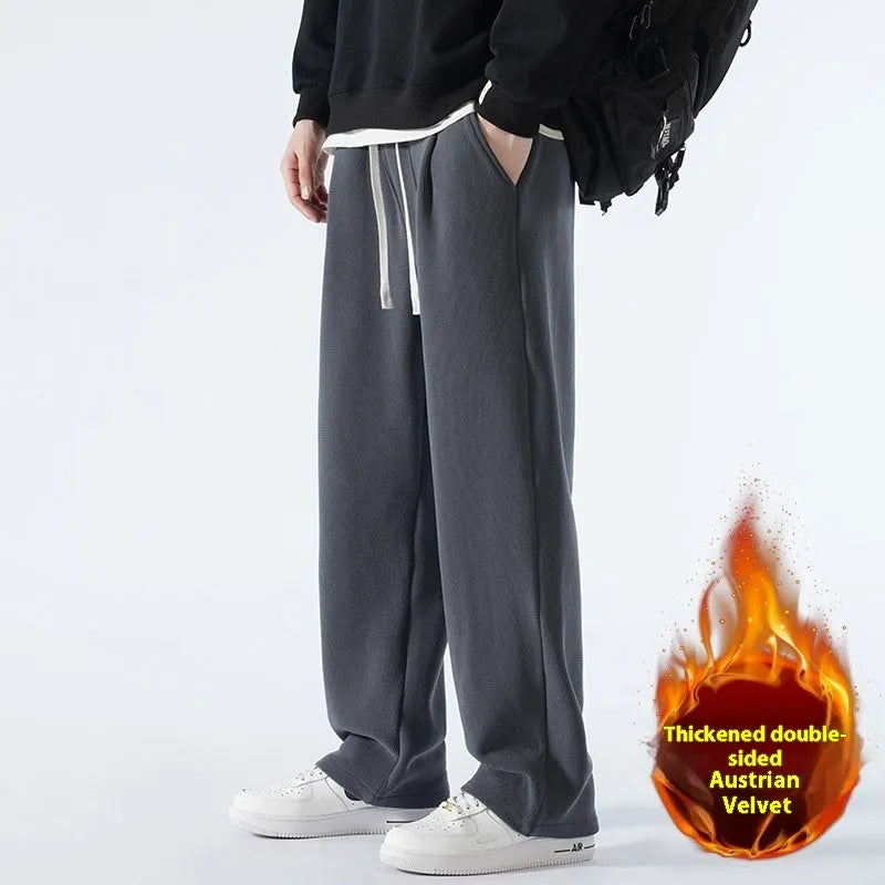 Men's apricot coloured loose-fit polar fleece-lined casual winter trousers on a white background.