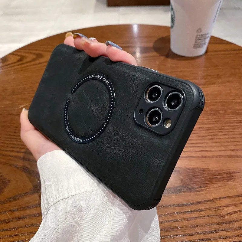 Black imitation leather magnetic charging case for iPhone on a table