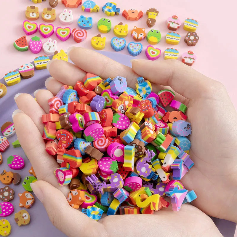 Assortment of 50 small colourful cartoon fruit and animal themed TPR rubber mini erasers.