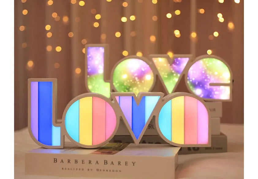 Rainbow-colour plastic LED LOVE light decoration measuring 35.5cm tall with 'LOVE' lettering